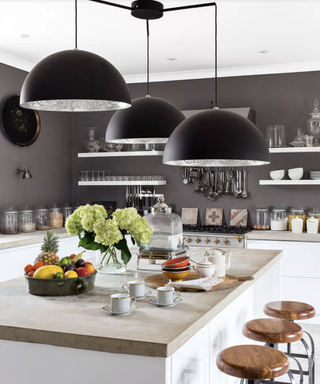 Black hanging kitchen lights design in a grey and white color scheme.