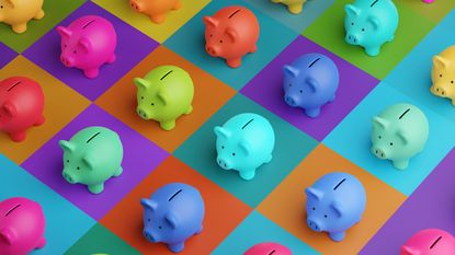 Multicolored piggy banks on a multicolored surface.