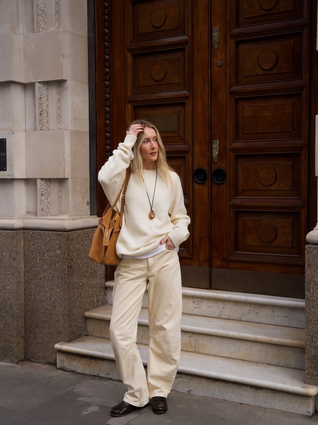 @chloekathbutler wears cream jeans cream jumper and loafers
