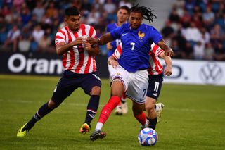 France 2024 Olympics squad France's midfielder #07 Michael Olise (R) runs with the ball during the U23 friendly football match between France and Paraguay at Jean Dauger stadium in Bayonne, southwestern France, on July 4, 2024, in preparation for the Paris 2024 Olympic Games. (Photo by GAIZKA IROZ / AFP) (Photo by GAIZKA IROZ/AFP via Getty Images)