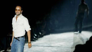 US fashion designer Tom Ford walks on the catwalk at the end of the Gucci collection during the Milan's 2004 Spring/Summer fashion week 02 October 2003