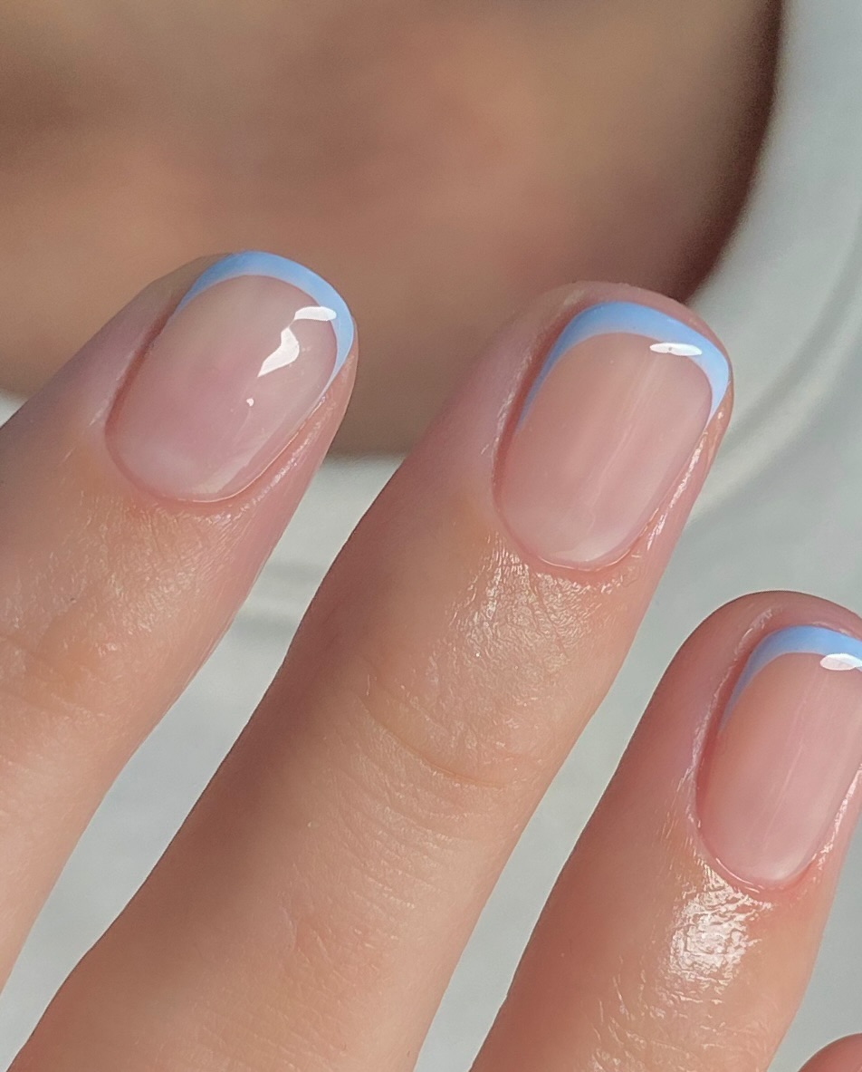 A pastel blue French manicyre