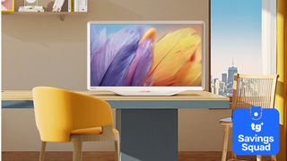 The Hisense Deco TV on a desk in a colorfully staged room