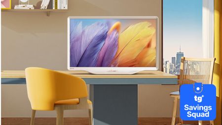 The Hisense Deco TV on a desk in a colorfully staged room