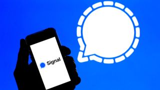 In this photo illustration a Signal app seen displayed on a smartphone with the Signal logo in the background.