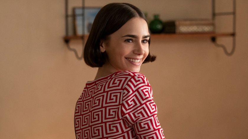 Lily Collins looking over her shoulder in Emily in Paris. 