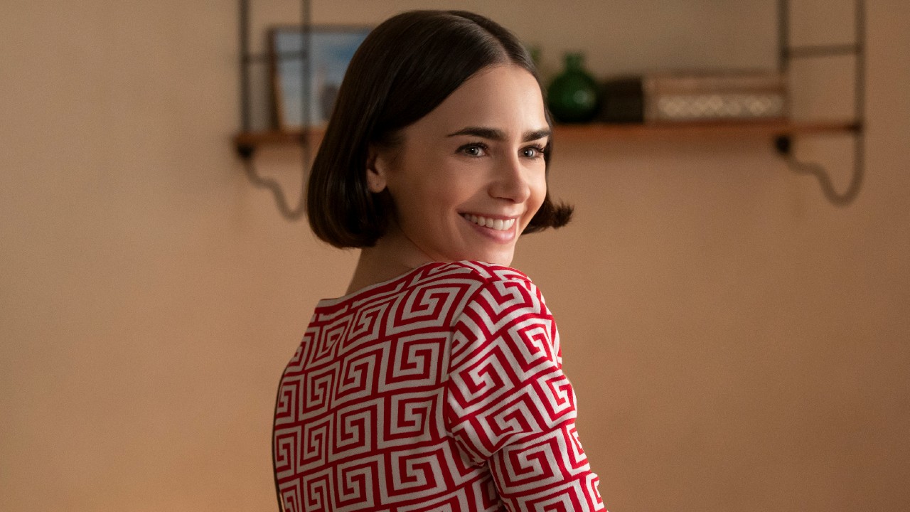 Lily Collins looking over her shoulder in Emily in Paris. 