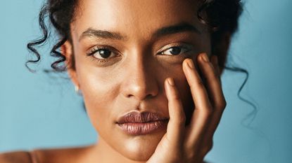 model wearing moisturizer on her face