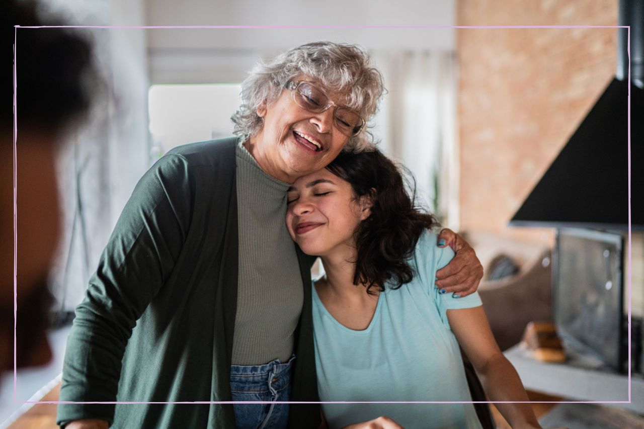 A grandmother hugging her teenage granddaughter