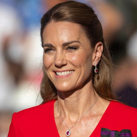 Princess Kate wearing a red dress and ruby jewelry at Wimbledon