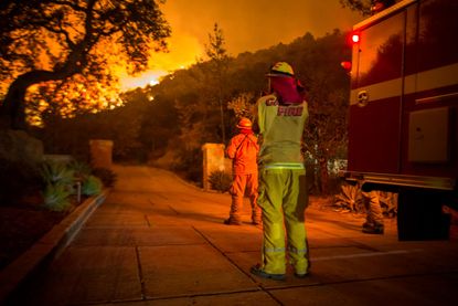 Firefighters watch the Thomas Fire.