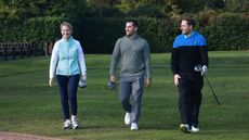 golfers walking