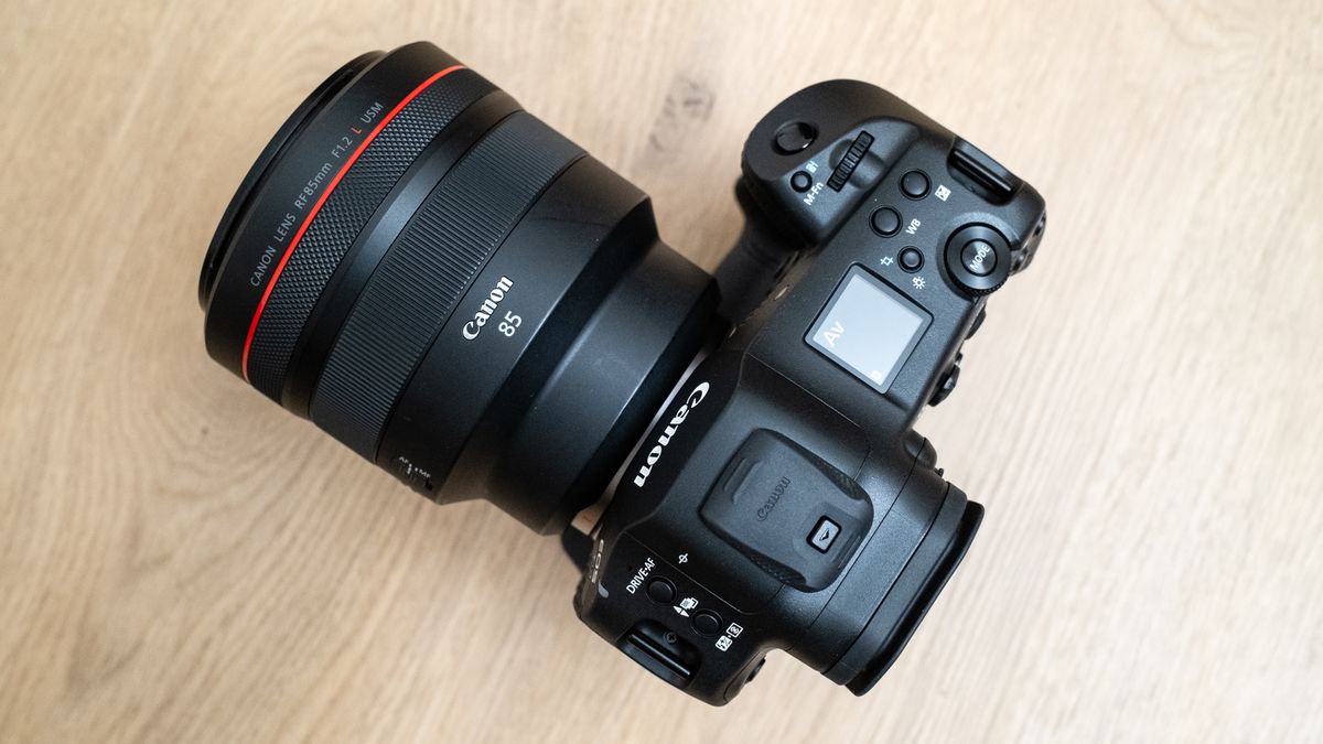 Canon RF 85mm f/1.2L USM attached to a Canon EOS R1 on a wood floor