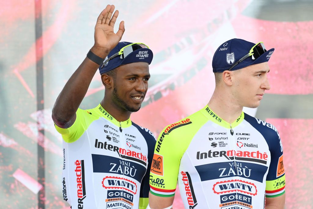 VISEGRAD HUNGARY MAY 06 LR Hailu Biniam Girmay of Eritrea and Barnabas Pek of Hungary and Team Intermarch Wanty Gobert Matriaux during the team presentation prior to the 105th Giro dItalia 2022 Stage 1 a 195km stage from Budapest to Visegrd 337m Giro WorldTour on May 06 2022 in Visegrad Hungary Photo by Stuart FranklinGetty Images