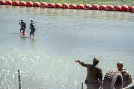 Texas border wire and floating barrier in Rio Grande