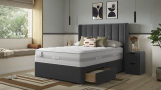 The Slumberland Response Latex Premium Mattress on a bed frame in a well decorated bedroom