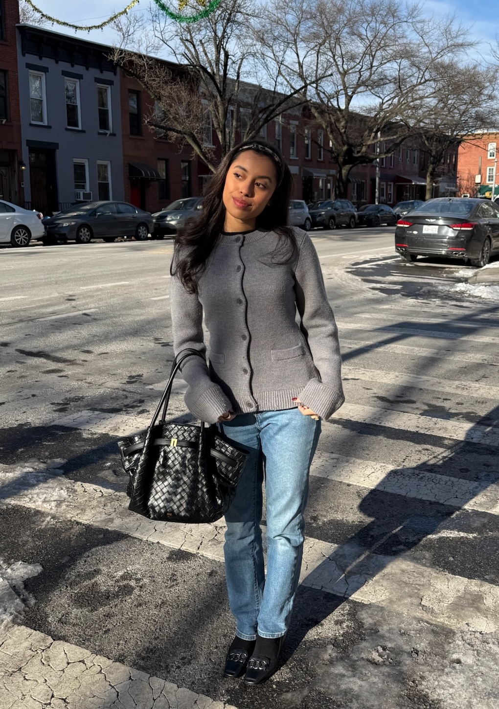 @rubyymcauliffe wearing a tapered cardigan sweater