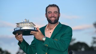 Scottie Scheffler holds up the Masters trophy after his win in 2024