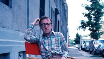 Eyewear, Glasses, Trousers, Shirt, Textile, Sunglasses, Sitting, Street fashion, Denim, Facial hair,