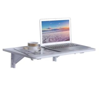 A white floating desk with a laptop and coffee cup on it