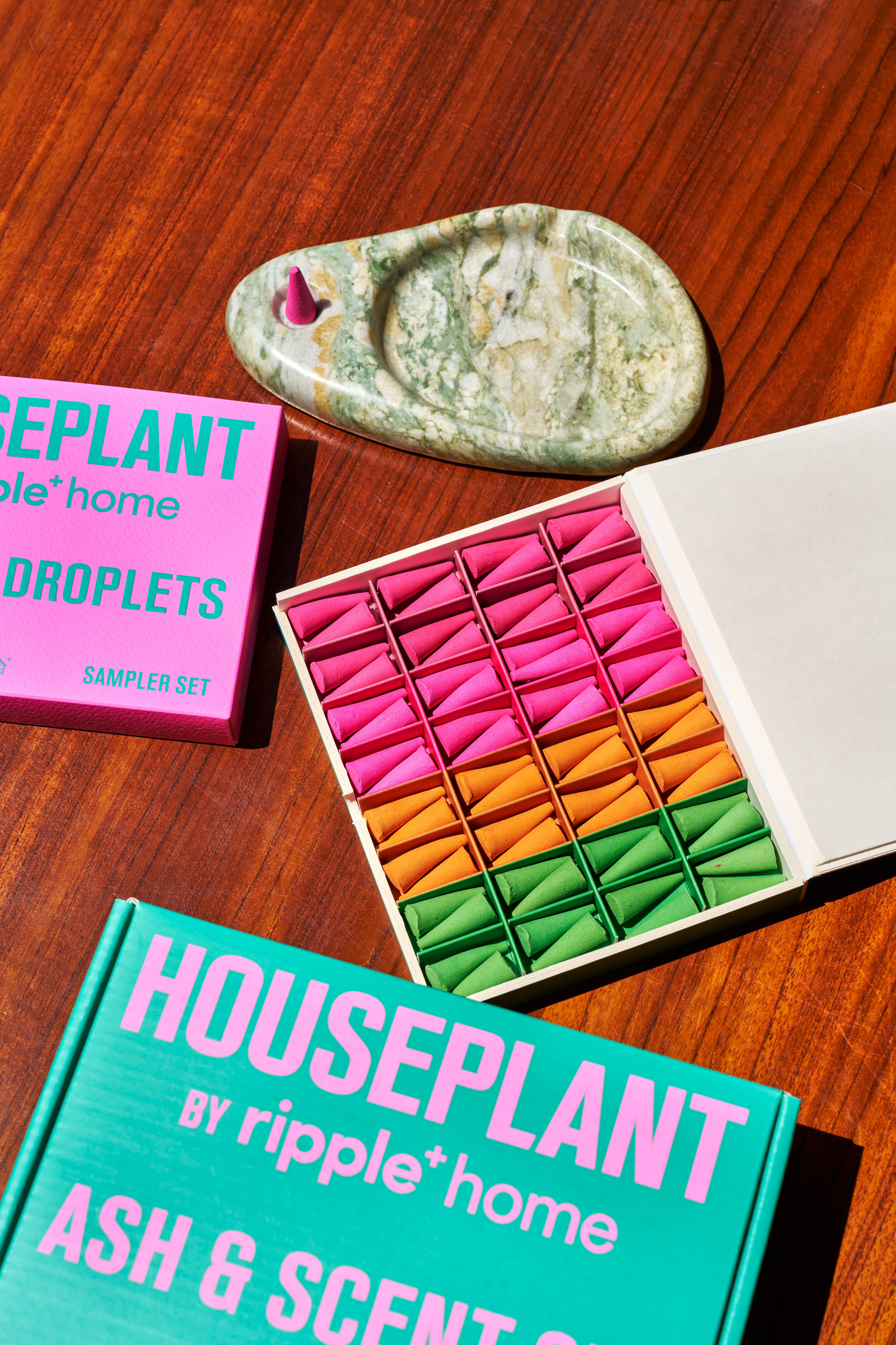 New incense by Seth Rogen's Houseplant collaboration with ripple plus, featuring colourful cones in pink, orange and green
