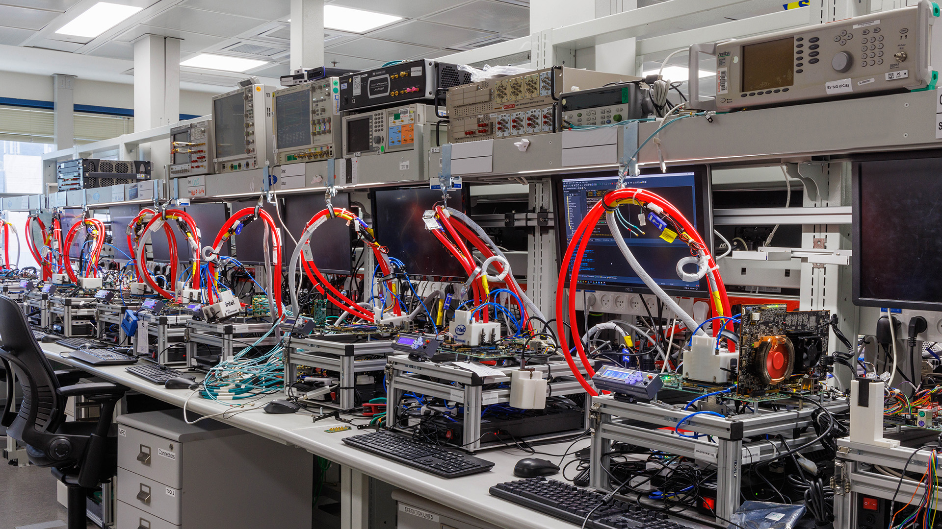 Lines of test benches for testing chips at Intel's IDC lab.