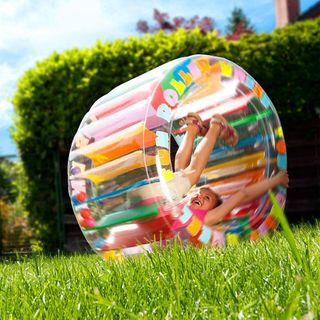 Child trying out garden zorbing