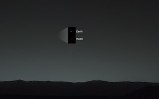 NASA's Mars rover Curiosity took this photo of Earth from the surface of Mars on Jan. 31, 2014, 40 minutes after local sunset, using the left-eye camera on its mast. The inset shows a zoomed-in view of the Earth and moon in the image.