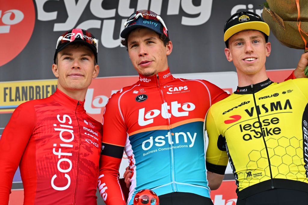 Matthew Brennan (right) on the Circuit de Wallonie podium alongside Arnaud De Lie and Axel Zingle