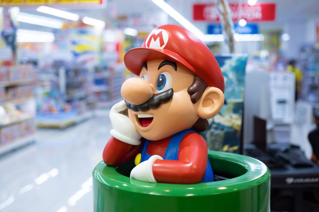 Nintendo&#039;s Super Mario figurine at a toy store entrance in Yokohama