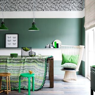 Dining room with green wall and green tablecloth