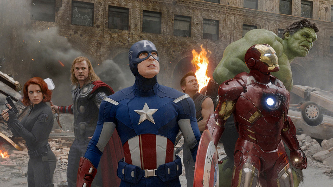 A screenshot of The Avengers looking up into the sky in their first MCU movie