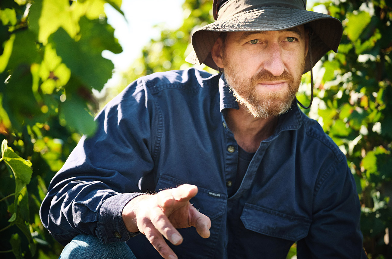 Robert Walters in the vineyards at the Place of Changing Winds winery in Mt Macedon, Victoria.