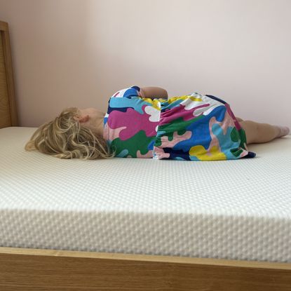 testing the comfort on the rem-fit kidz mattress