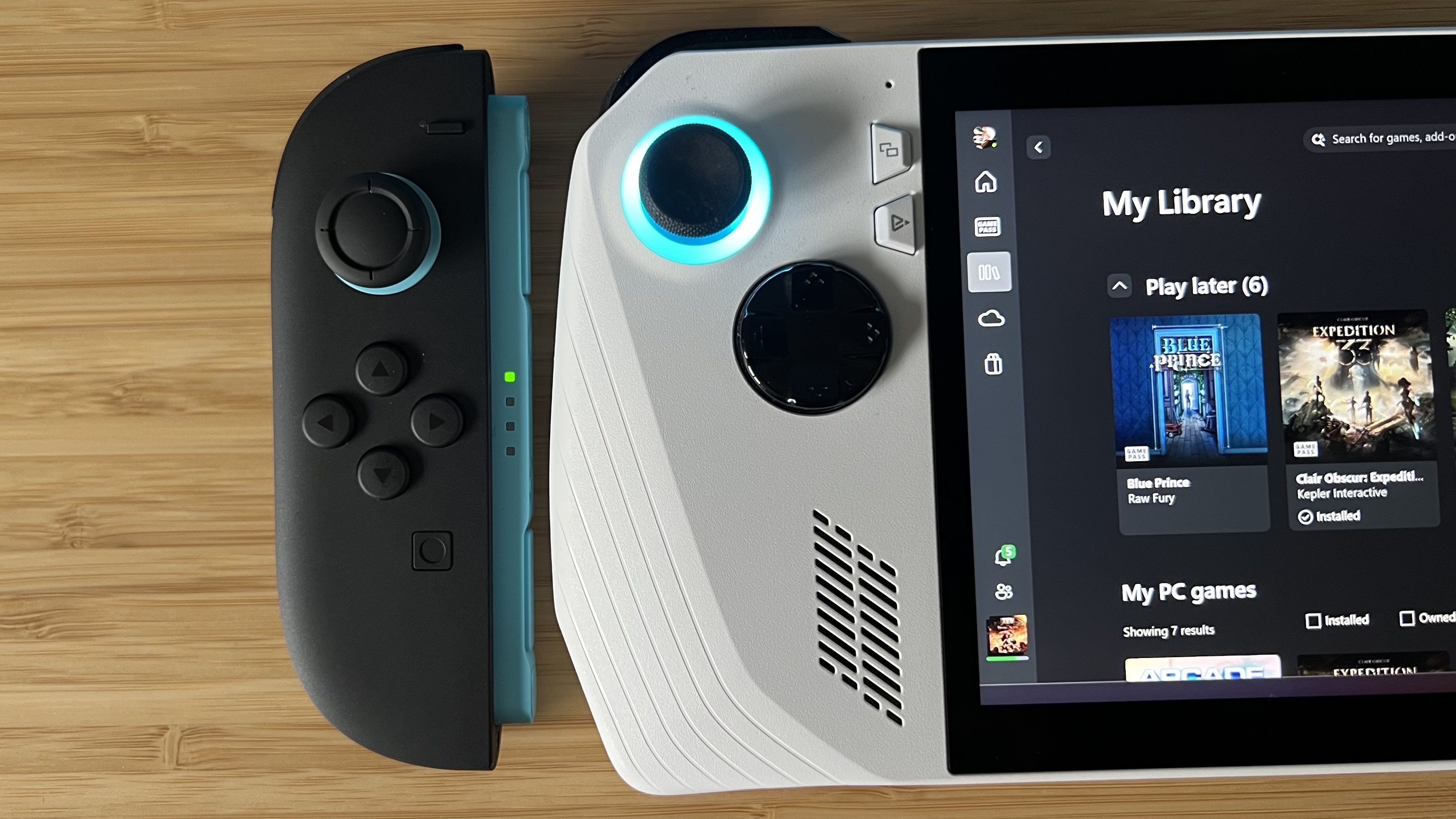 Nintendo Switch 2 Joy-Con next to the right side of the Asus ROG Ally's controls