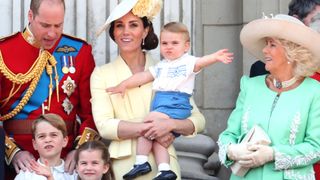 Prince Louis in Kate Middleton's arms on the balcony of Buckingham Palace