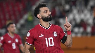 ohamed Salah Salah Mahrous Ghaly of Egypt, wearing red soccer kit, warms up for the Egypt vs Ghana live stream at AFCON