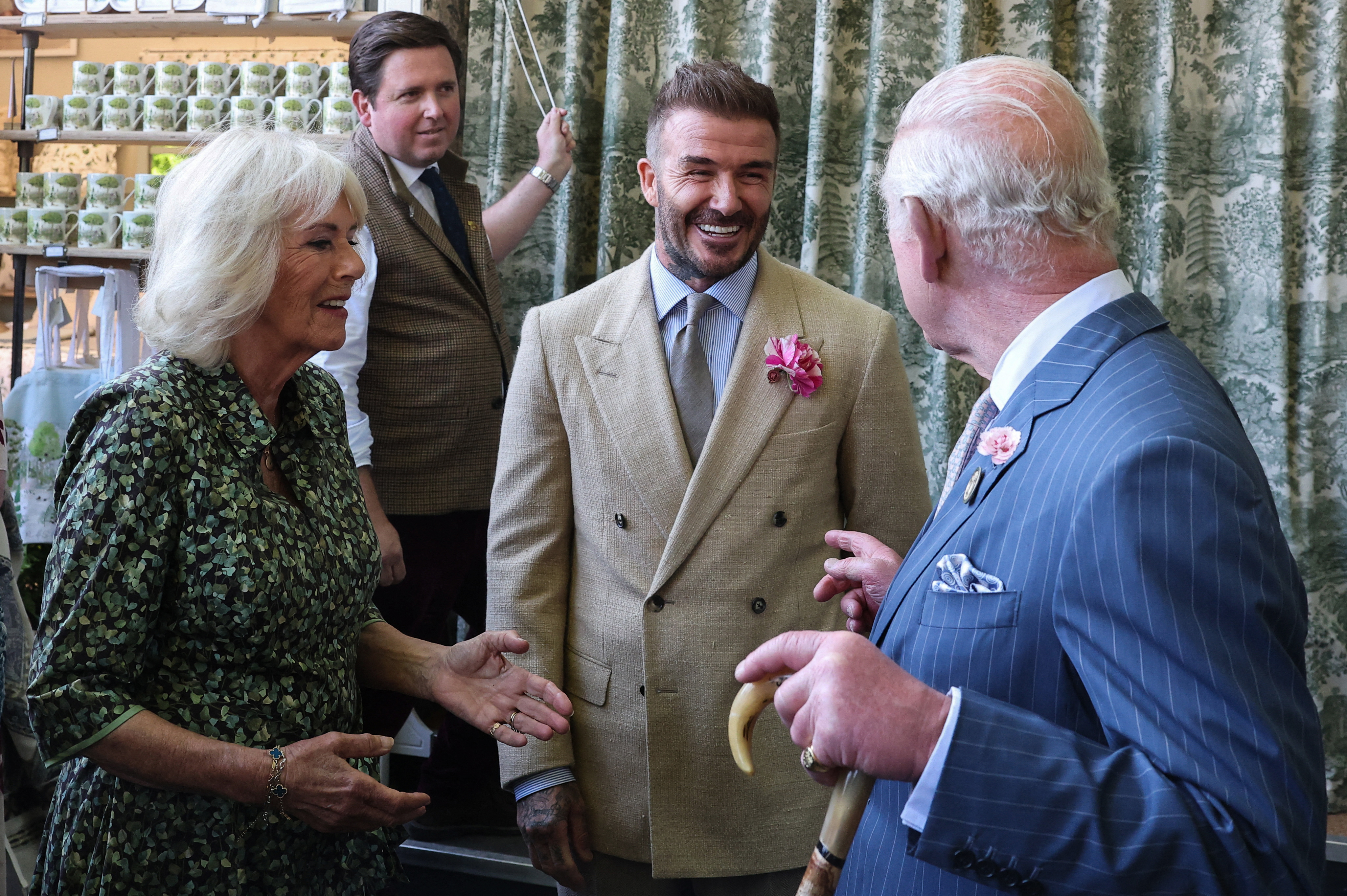 David Beckham talking to Queen Camilla and King Charles