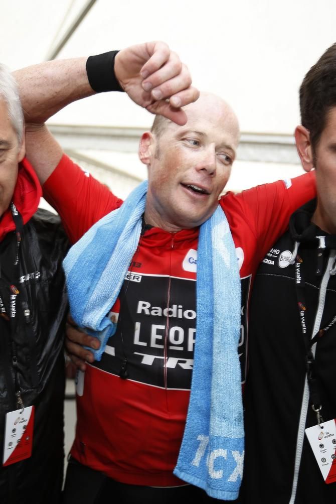 Chris Horner (RadioShack) is helped at the finish