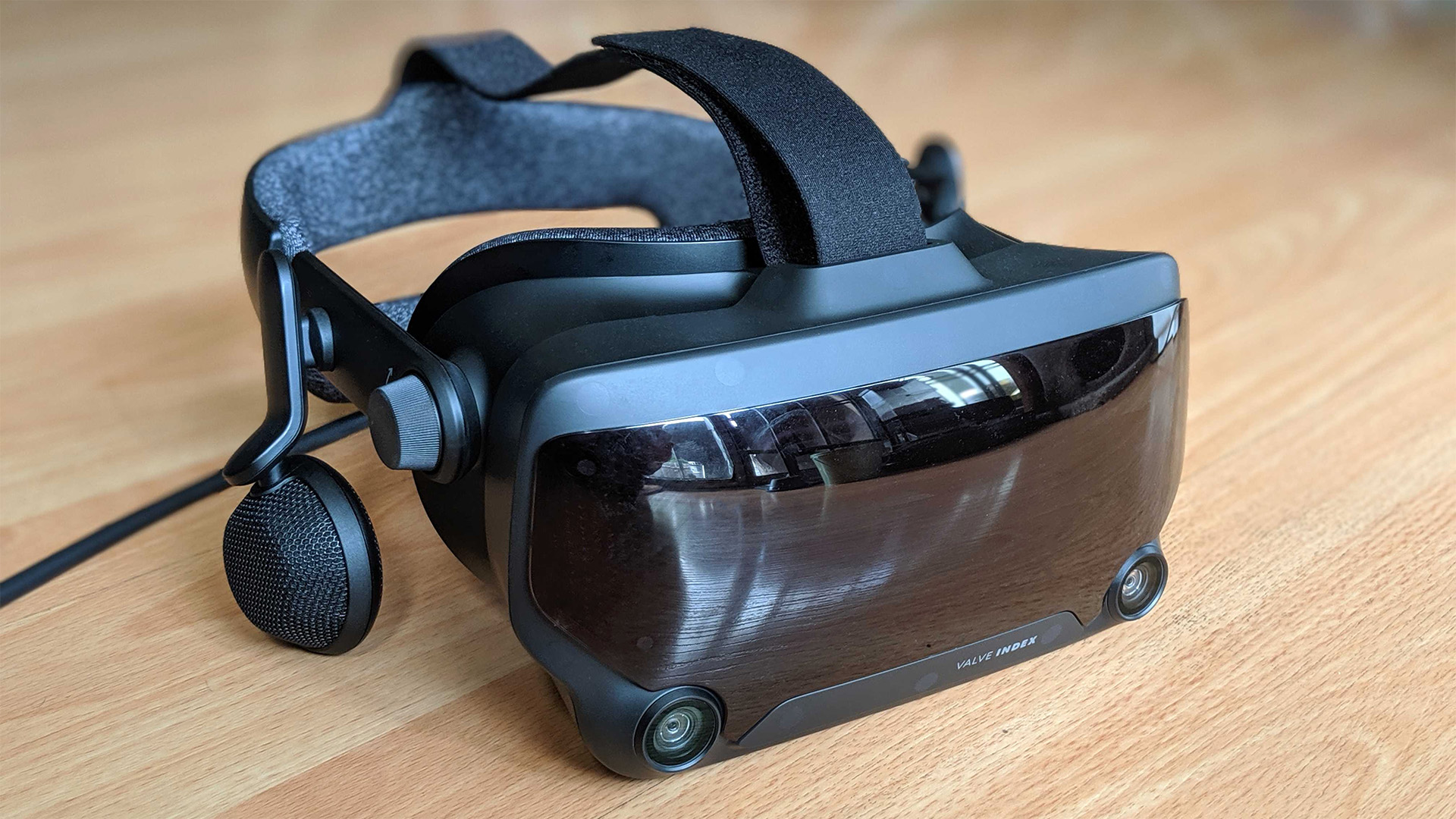 Valve Index virtual reality headset on a table front right angle.