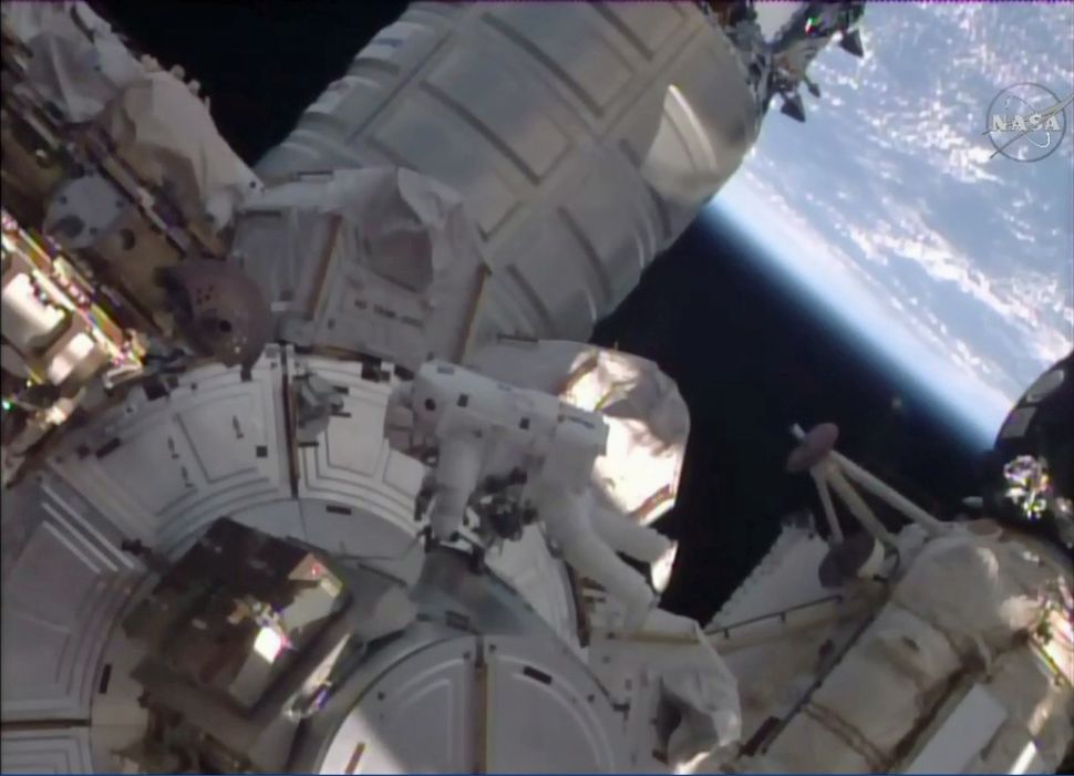 Spacewalking Astronauts Rescue Stuck Space Station Railcar Space