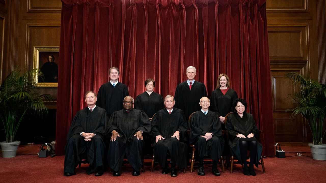 Members of the Supreme Court pose for a group photo