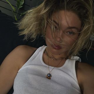 Gigi Hadid wearing a ribbed white tank top on Instagram June 2024