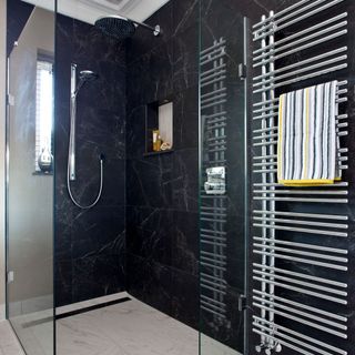 bathroom with black marble and shower