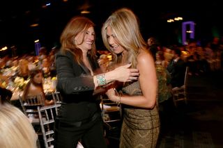 Actresses Julia Roberts (L) and Jennifer Aniston attend TNT's 21st Annual Screen Actors Guild Awards at The Shrine Auditorium on January 25, 2015 in Los Angeles, California