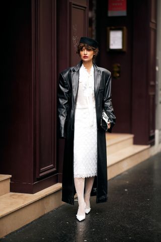 woman wearing white floral tights paris fashion week FW25