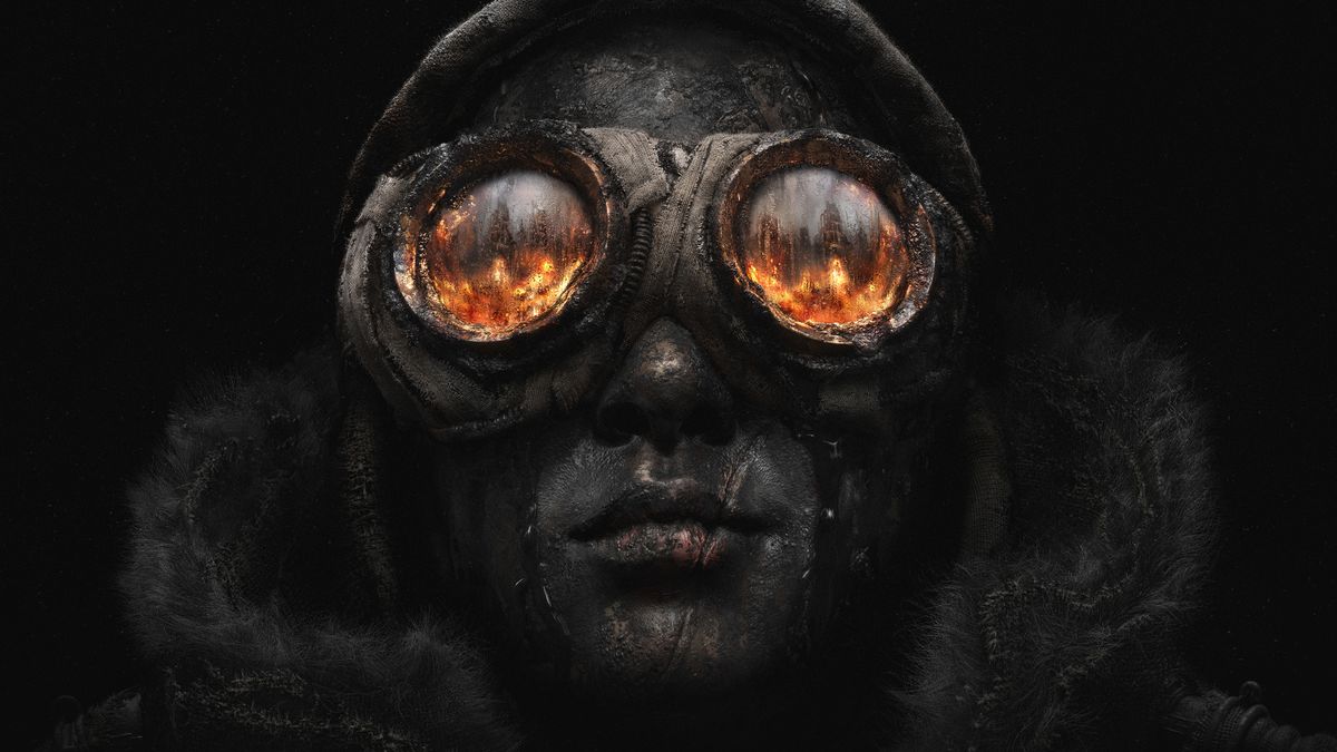 A face covered with oil and reflection of fire in goggles