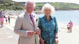 Camilla, Duchess of Cornwall pictured wearing a Fitbit alongside Prince Charles at Porthcressa Beach, UK