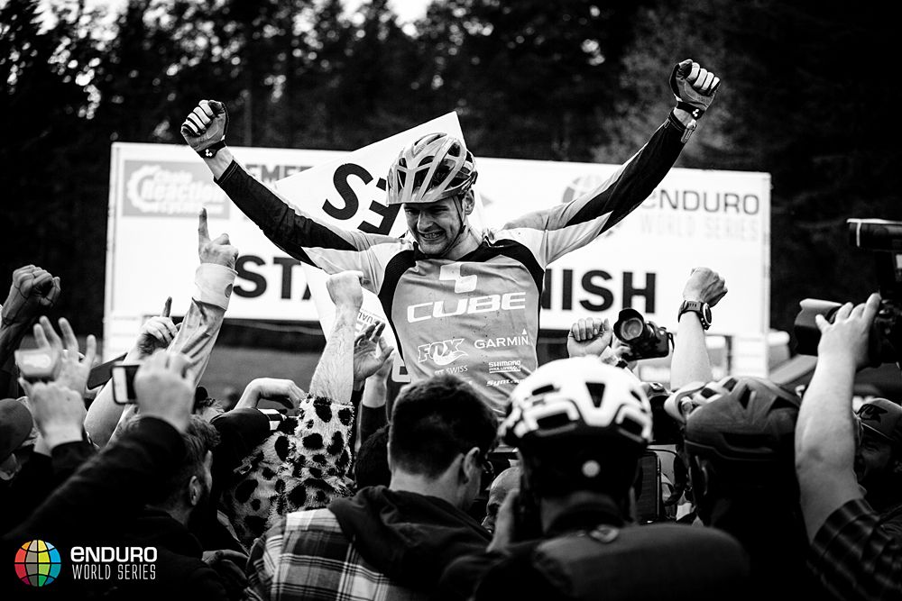 Greg Callaghan (Cube Action Team) lifted by fans at the finish line