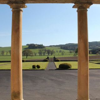 view from house with pillars and grassland